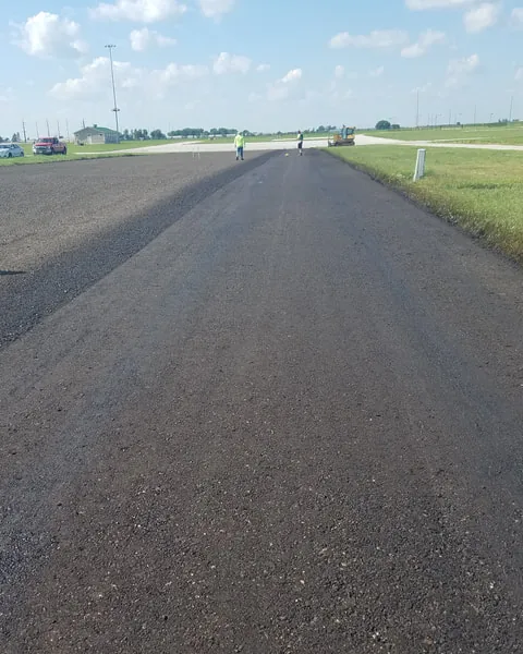 Long rural road surfaced with HawkSeale-treated millings